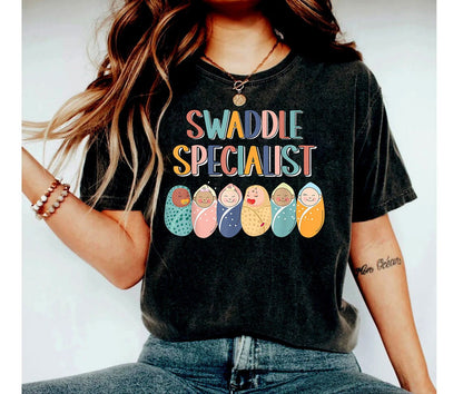 Funny Swaddle Specialist Shirt, Caregiver Tee, Baby Crew Shirt, Labor Delivery Nurse Tee, Trendy Newborn Gift, Nurse RN Tee, Postpartum tee