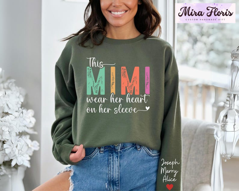 This Mimi Wear Her Heart On Her Sleeve Mimi Sweatshirt, Custom Mimi Sweatshirt With Kids Name, Nana Gift Hoodie, Kids Name on Sleeve